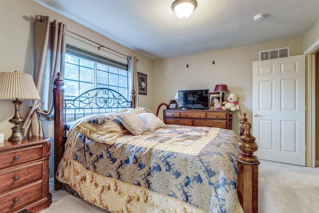 bedroom with light carpet