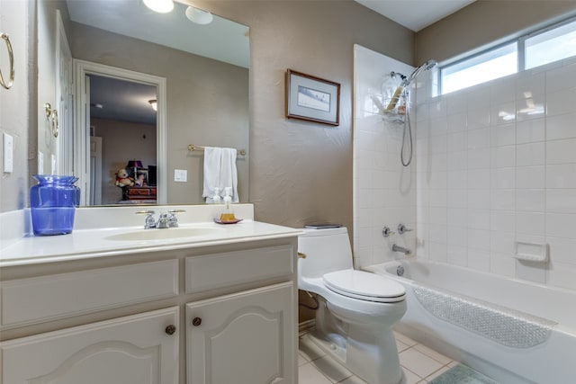 full bathroom with tile patterned flooring, vanity, toilet, and tiled shower / bath