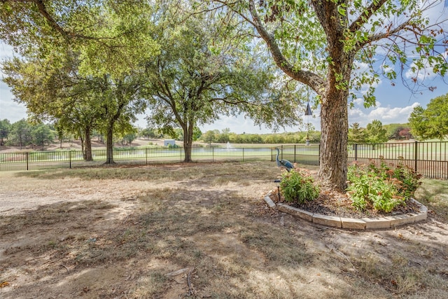 view of yard with a rural view