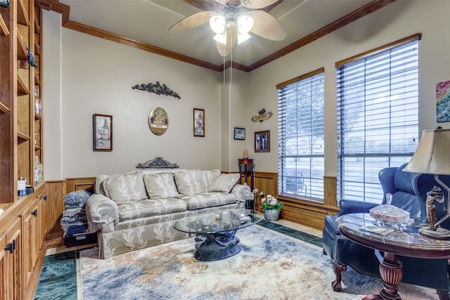 living room with ornamental molding, ceiling fan, wooden walls, built in features, and dark hardwood / wood-style floors