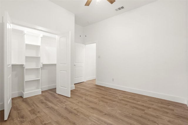 unfurnished bedroom with light wood-type flooring and ceiling fan