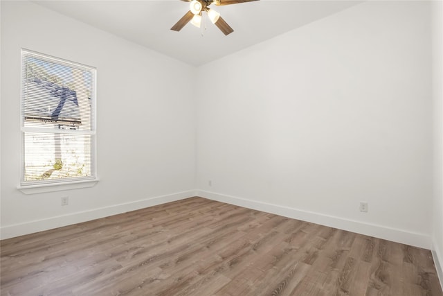 empty room featuring ceiling fan and light hardwood / wood-style flooring