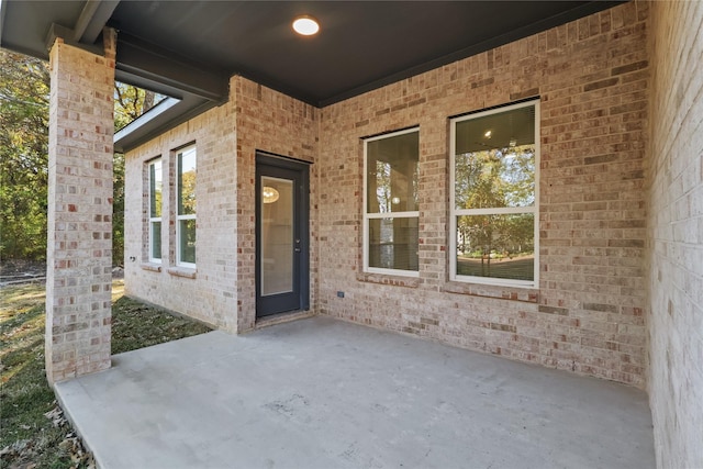 property entrance with a patio area