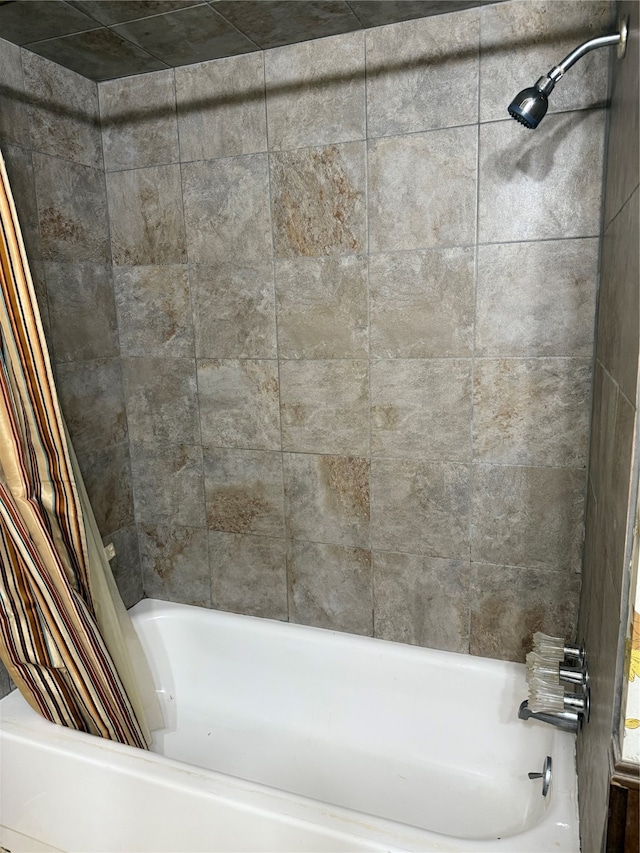 bathroom featuring shower / tub combo with curtain