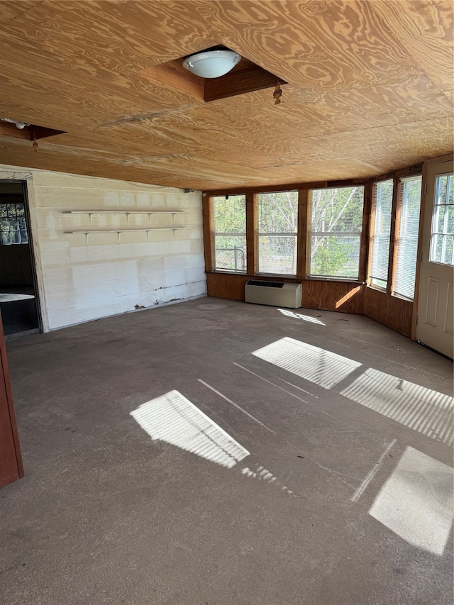 interior space featuring a wealth of natural light and a baseboard heating unit