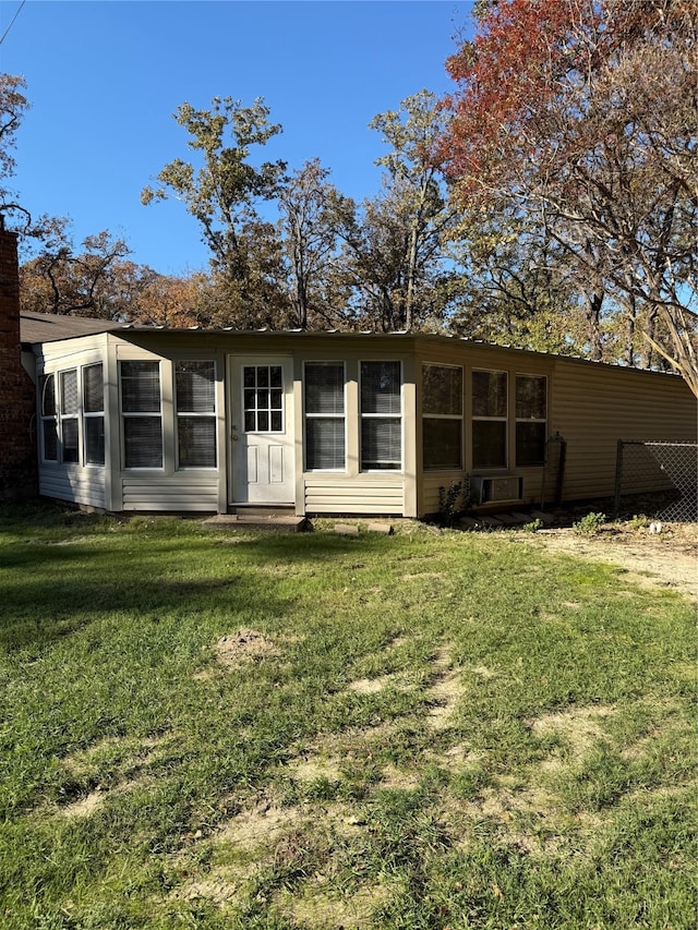 back of house with a yard