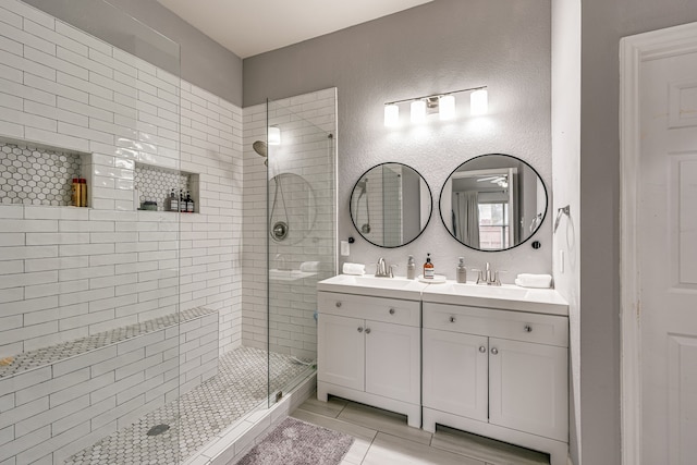 bathroom featuring an enclosed shower, vanity, and tile patterned floors