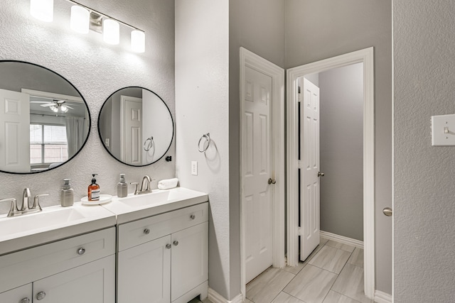 bathroom featuring ceiling fan, tile patterned flooring, and vanity