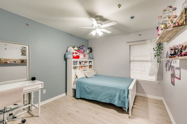 bedroom featuring ceiling fan and light hardwood / wood-style flooring