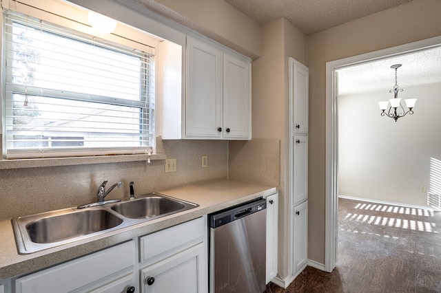 kitchen with sink, stainless steel dishwasher, a textured ceiling, decorative light fixtures, and white cabinetry