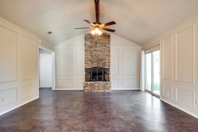 unfurnished living room with a textured ceiling, a brick fireplace, ceiling fan, and lofted ceiling