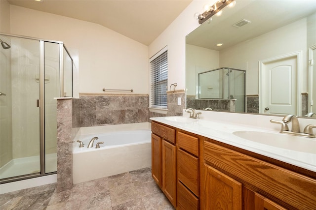 bathroom with vanity, lofted ceiling, and shower with separate bathtub