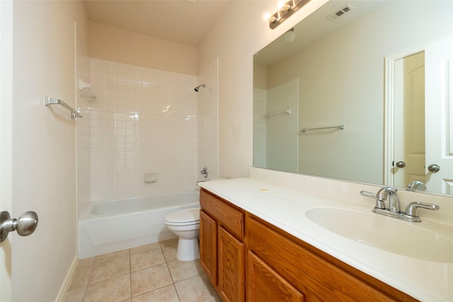 full bathroom with tile patterned floors, vanity, toilet, and tiled shower / bath