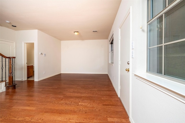 spare room featuring dark hardwood / wood-style floors