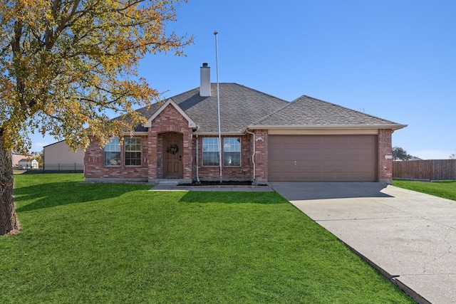 single story home featuring a garage and a front lawn