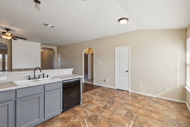 kitchen with sink, dishwasher, ceiling fan, gray cabinetry, and vaulted ceiling