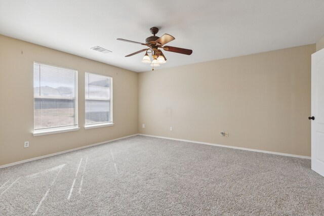 carpeted empty room with ceiling fan