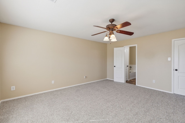 unfurnished bedroom with carpet floors, ceiling fan, and ensuite bathroom