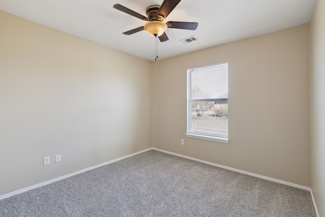 spare room with carpet and ceiling fan