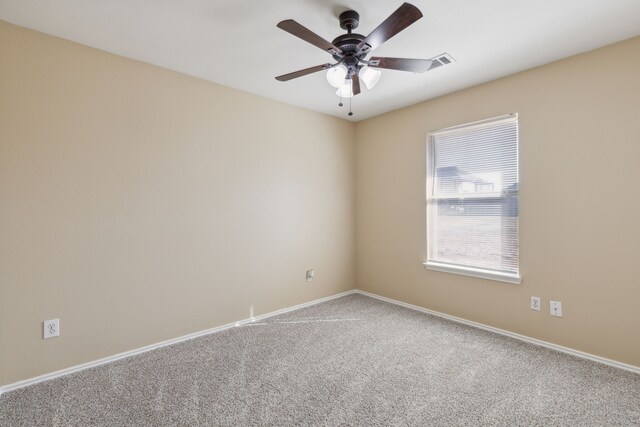 carpeted empty room with ceiling fan