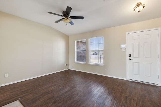 entrance foyer featuring vaulted ceiling, dark wood-type flooring, and ceiling fan