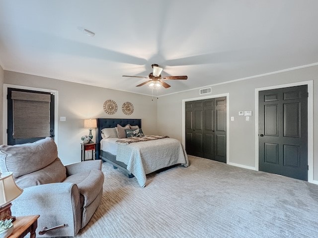 bedroom featuring carpet flooring, ceiling fan, and crown molding