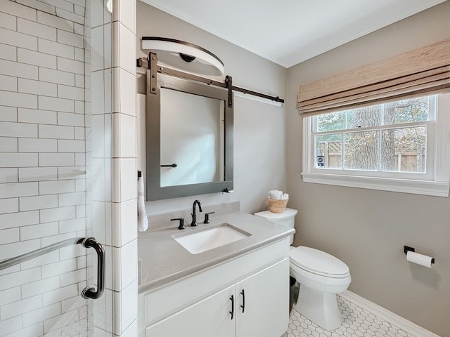 bathroom with tile patterned floors, walk in shower, vanity, crown molding, and toilet