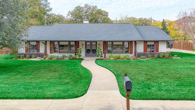 single story home featuring a front yard