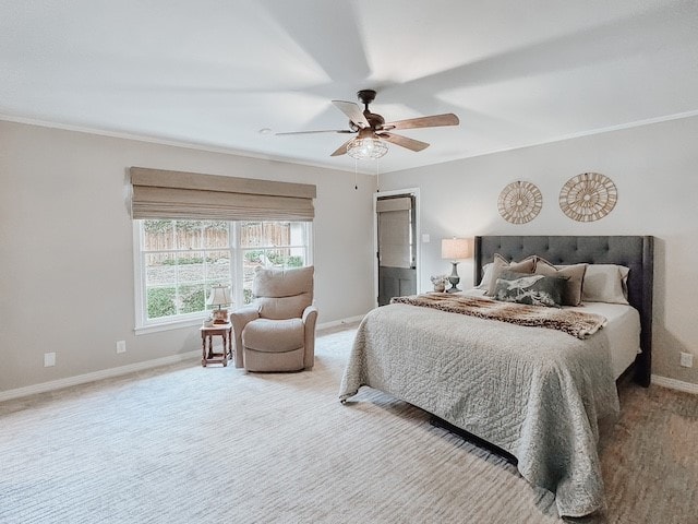 carpeted bedroom featuring ceiling fan and ornamental molding