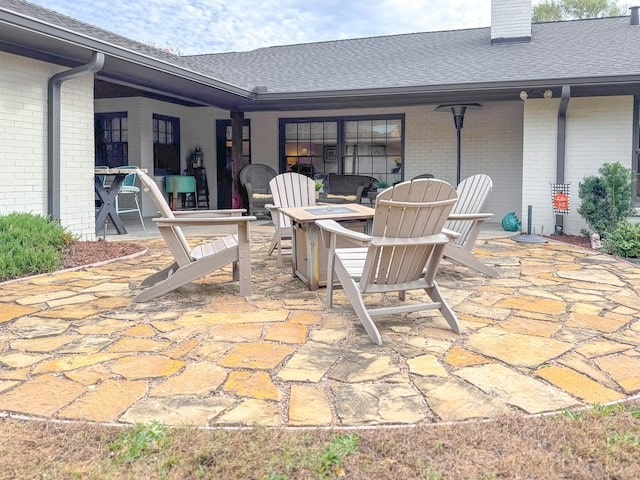 view of patio featuring an outdoor fire pit