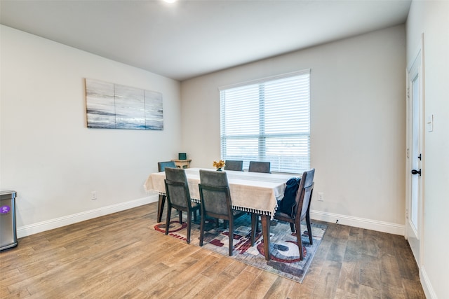 dining area with wood-type flooring