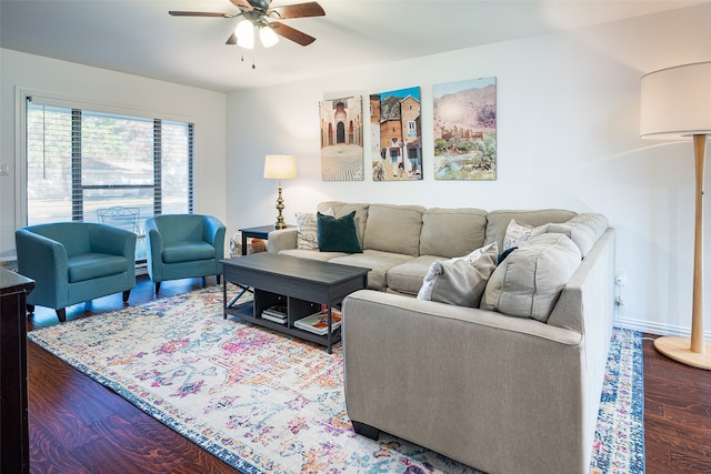 living room featuring ceiling fan and hardwood / wood-style floors