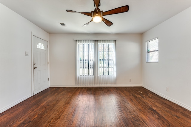 foyer with ceiling fan and dark hardwood / wood-style flooring