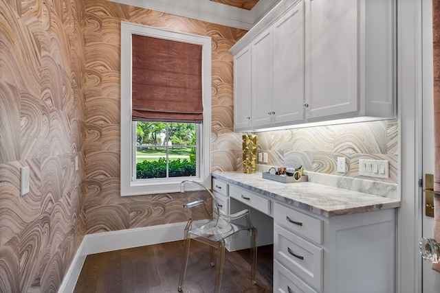 office area with hardwood / wood-style floors and built in desk