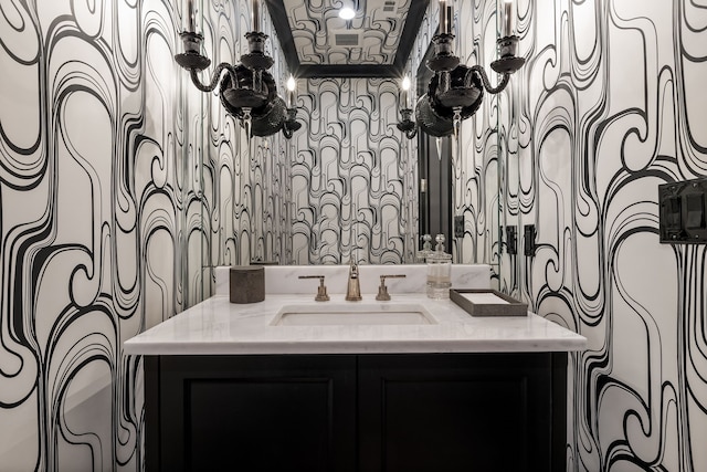 bathroom with vanity and crown molding