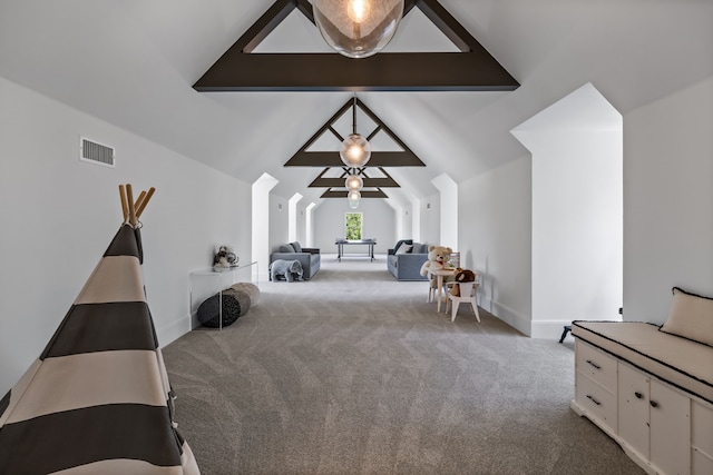 interior space with lofted ceiling and light colored carpet