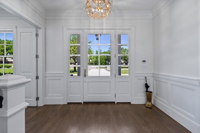 entryway with dark hardwood / wood-style flooring and a chandelier