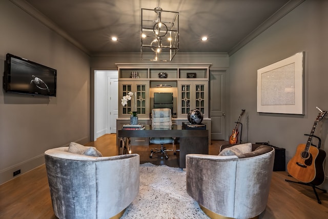 interior space with ornamental molding, an inviting chandelier, and light hardwood / wood-style flooring