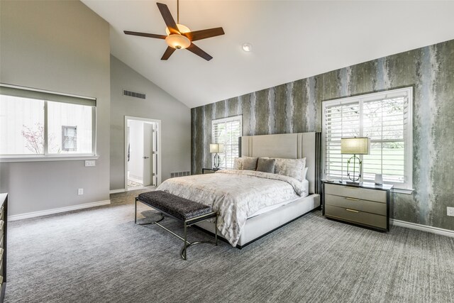 bedroom with carpet flooring, ensuite bath, ceiling fan, and high vaulted ceiling