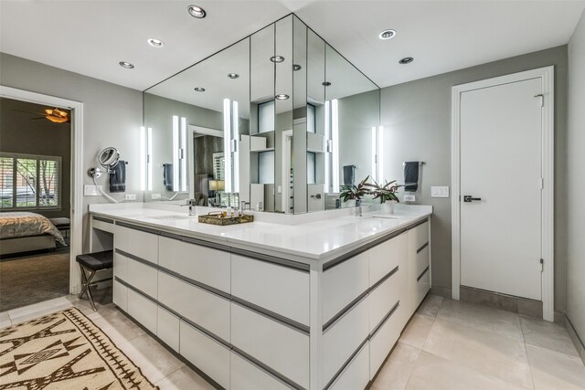 bathroom with tile patterned floors, ceiling fan, and vanity