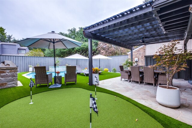 exterior space with outdoor lounge area, a pergola, and exterior kitchen