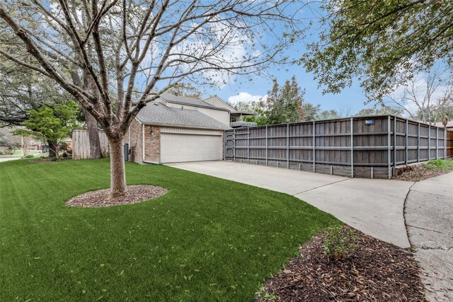 exterior space featuring a garage and a lawn