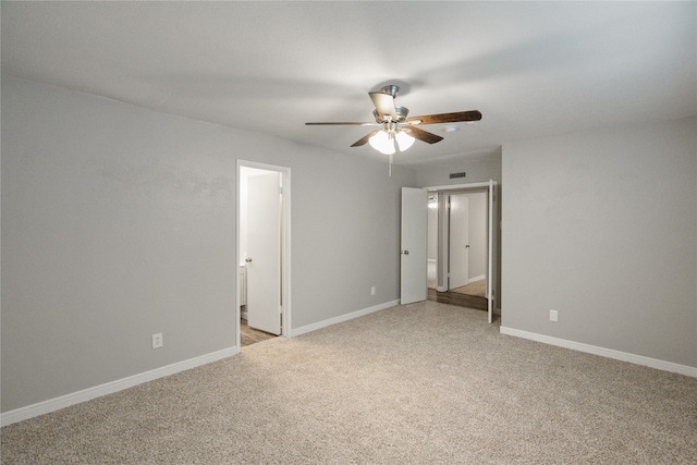 spare room with ceiling fan