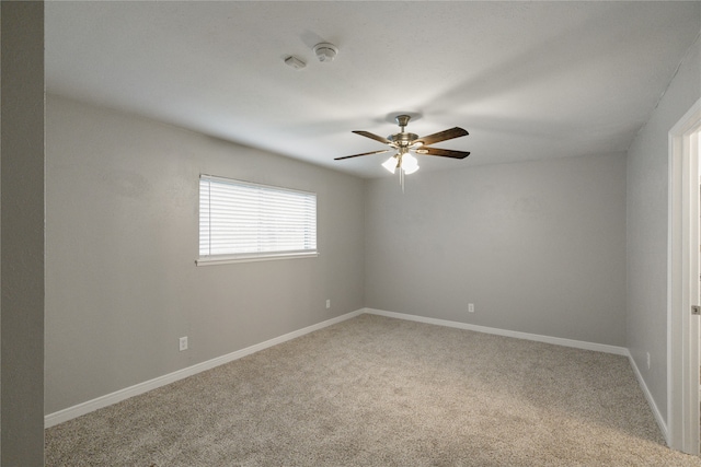 carpeted empty room with ceiling fan