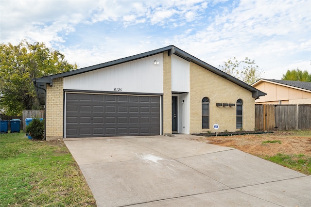 single story home with a garage