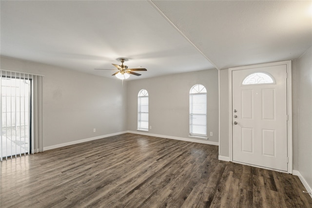 foyer featuring ceiling fan and dark wood-type flooring