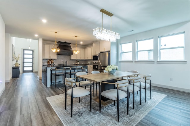 dining area featuring dark wood-type flooring