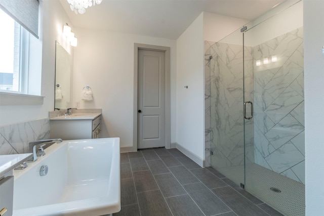 bathroom featuring vanity and a shower with shower door