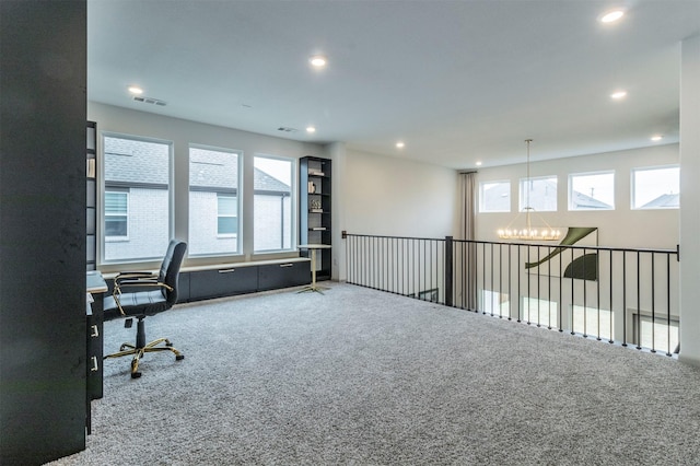 office space with an inviting chandelier and carpet