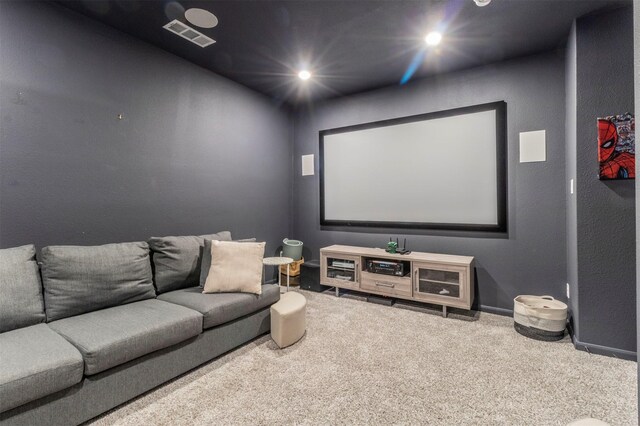 cinema room featuring carpet floors